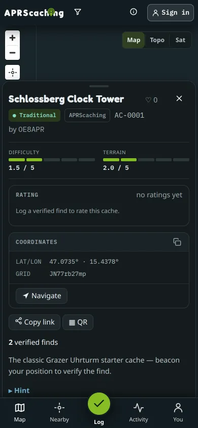 A cache sheet on a phone, with difficulty, terrain, coordinates and the Log button in the bottom bar